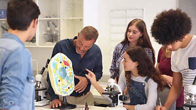Professor of biology explaining cell in class