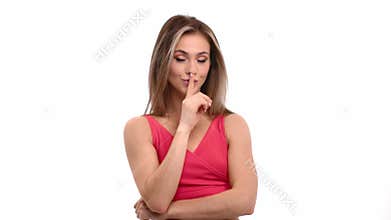 Playful female demonstrate gesture quiet showing forefinger no isolated. Shot with RED camera in 4K