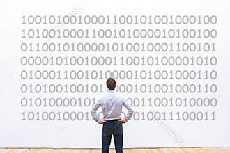 Programmer looking at binary code, coding concept, data encryption