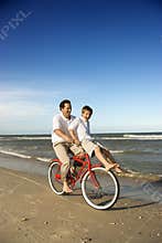Dad and son riding bicycle