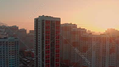 New modern residential complex in a residential area in the morning at dawn against the backdrop of the bright sun in