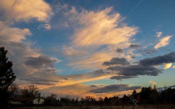 Sunset skies in the fall over the suburban neighborhood