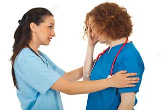 Doctor comforting her colleague