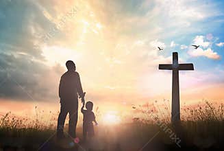 Christian Father and Child Looking at Cross in Sunrise Worship with Family Trust Concept
