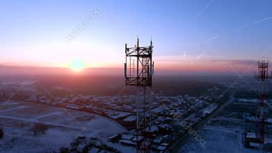 Aerial view panoramic landscape of cell towers at dawn in winter.