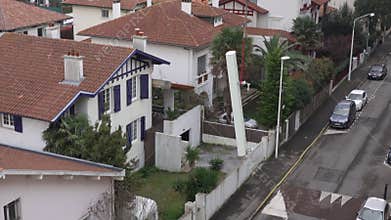 5G antenna being lifted by a crane
