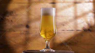 Pouring beer into a glass.