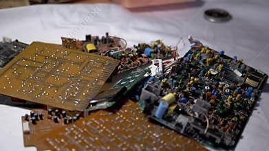 Old Printed Circuit Boards, Microcircuits, Radio Components Falling on Table