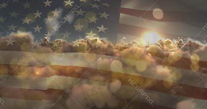 Animation of glowing spots and sun shining on sky with clouds over american flag