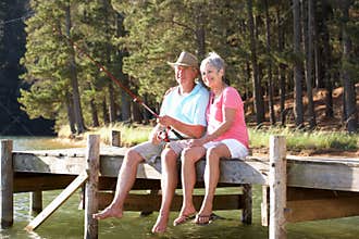 Senior couple having fun fishing