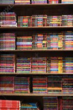 Kolkata, India, February 12.2021. A vertical photo of bookshelf with many colored story books and graphic novel for sale inside a