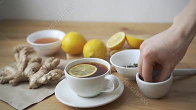 Cup of healthy tea with different kind of dryed herbs and flowers