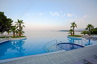 Luxury infinity pool with stunning sea view