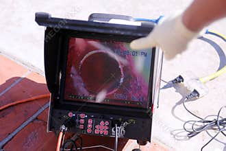 Plumbers sewer snake camera. a snake camera checks the inside of a sewer drain to make sure its clear of blockage and or damage.