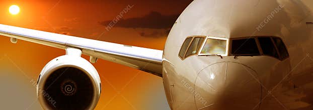 Airplane flying, sunset
