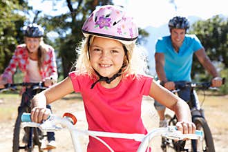 Young family on country bike ride