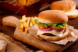 Fast Food Burger on a Wooden Platter and Table