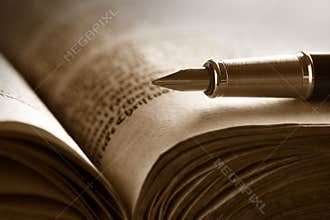 Old book and pen
