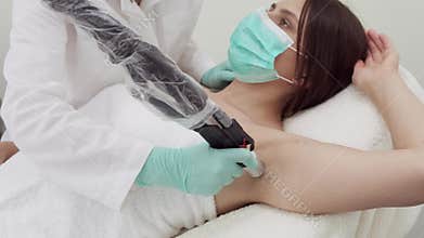 Armpit laser hair removal. Cosmetology. Beauty clinic.