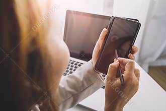 Social media interactions on mobile phone. concept with notification icons of social media. businessman hands holding device.