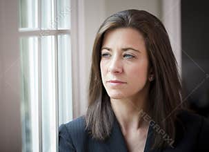Woman looking out of window