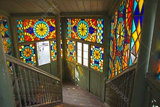 Rainbow sunny bunnies on the stairwell with stained glass windows