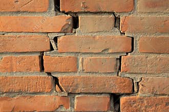 Crack of red brick wall