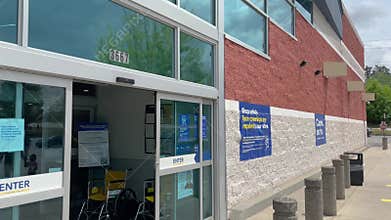 Best Buy retail store entrance and building signage cloudy sky