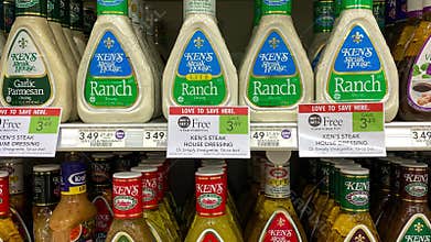 Panning up on bottles of Kens Salad Dressing at a Publix grocery store