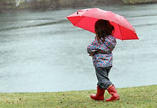 Little girl in the rain