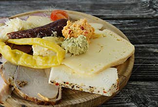 a rustic meal of cheeses and cold cuts in the Austrian Alps of the Schladming-Dachstein region (Styria in Austria)