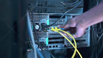IT technician sets system man switches cables check server