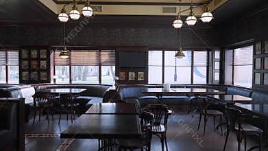 Wide shot interior of luxurious modern restaurant with no people. Stylish comfortable pub indoors without visitors. Live