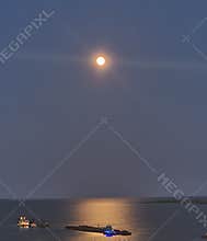 Gulf cleanup under moon