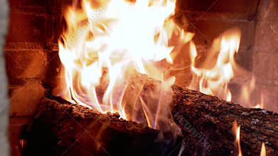 Burning fireplace, real wood logs, cozy warm home at xmas time