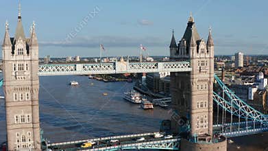 Forwards fly above Tower Bridge. Heavy traffic on road through historic landmark spanning River Thames. London, UK