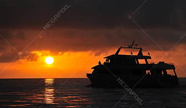 Sunset over dive boat