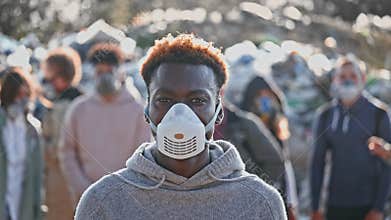 Portrait of a Sad Black Young Man in Gas Mask Standing in Toxic Smoke. Saving the Planet.