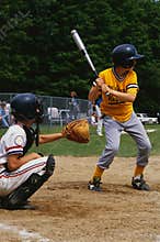 Kids playing in a little league baseball game