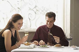 Couple dining at restaurant.