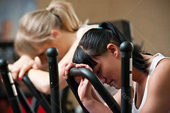 Tired women in gym