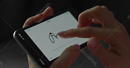 Digital signature on mobile screen by finger. Woman hand