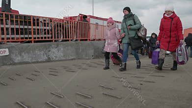 Isaccea, Romania. 08 March, 2022. Refugee Ukrainians walk from Ukraine to Romania after crossing the border