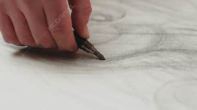 Art school advertising. Artist hand holding pencil drawing lines, painting draft on canvas. Close-up, prores codec