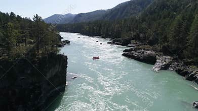 Paddling Through  turquoise Rapids. Whitewater Rafting Teams Descending Raging Rapids.   White Water Rafting on Rough Water. Mount