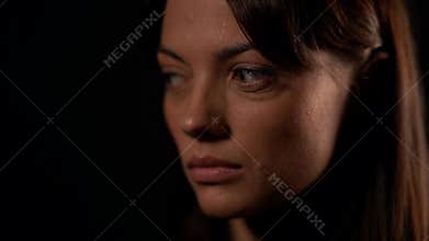 Sad look of young beautiful woman, closeup of face, sadness and sorrow, emotional portrait
