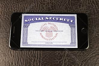 Social Security card blank on a smartphone. The Social Security Administration oversees retirement, disability, and benefits