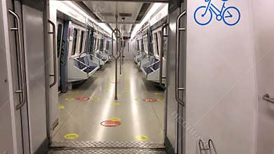 Empty seats and corridor of a subway at the station during covid quarantine