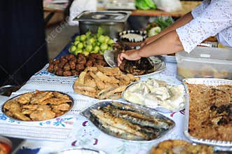 Shallow depth of field selective focus image with traditional Danube Delta meals fish based on a table