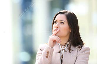 Entrepreneur wondering in the street looking at side